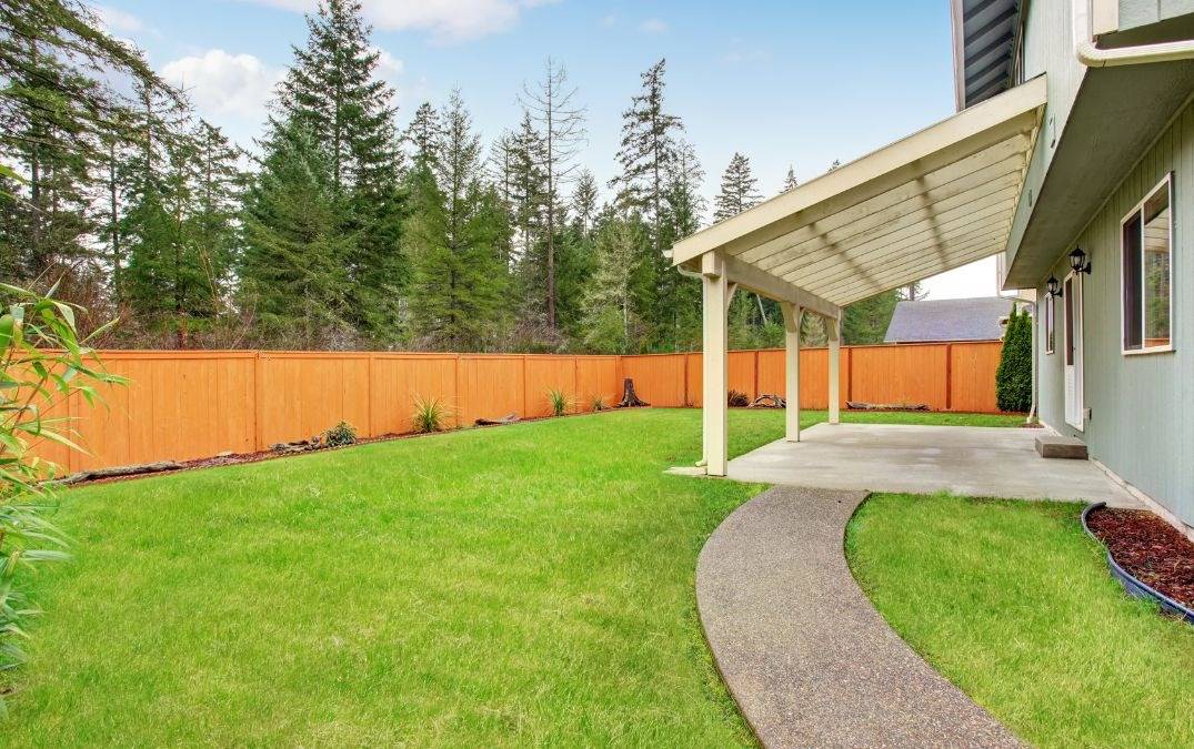 Residential concrete path leading to a house.