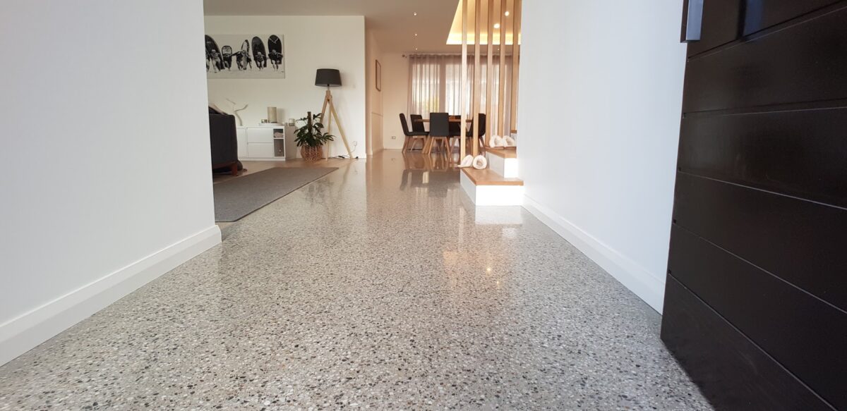 polished concrete flooring which has been cleaned, a hallway