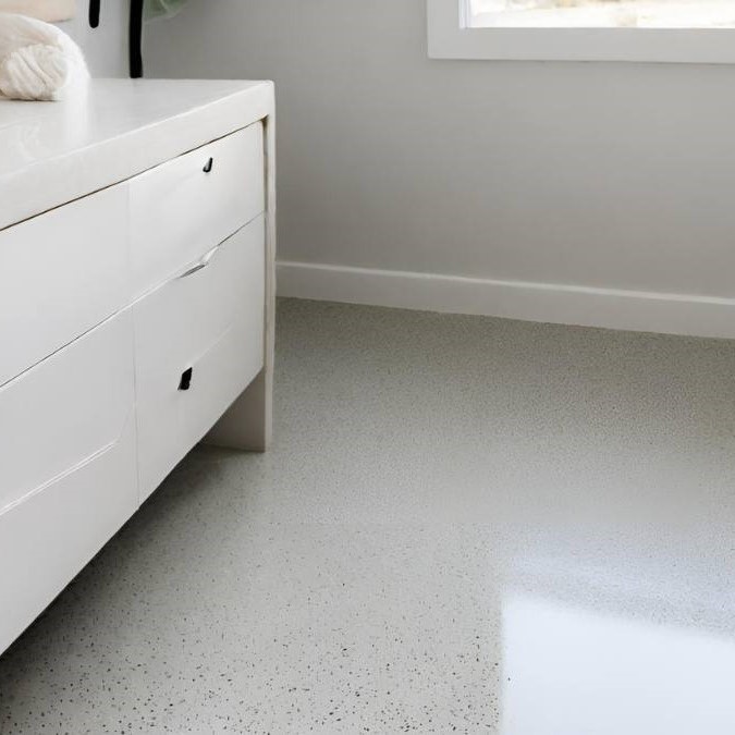 a salt and pepper polished concrete floor in a residential bathroom