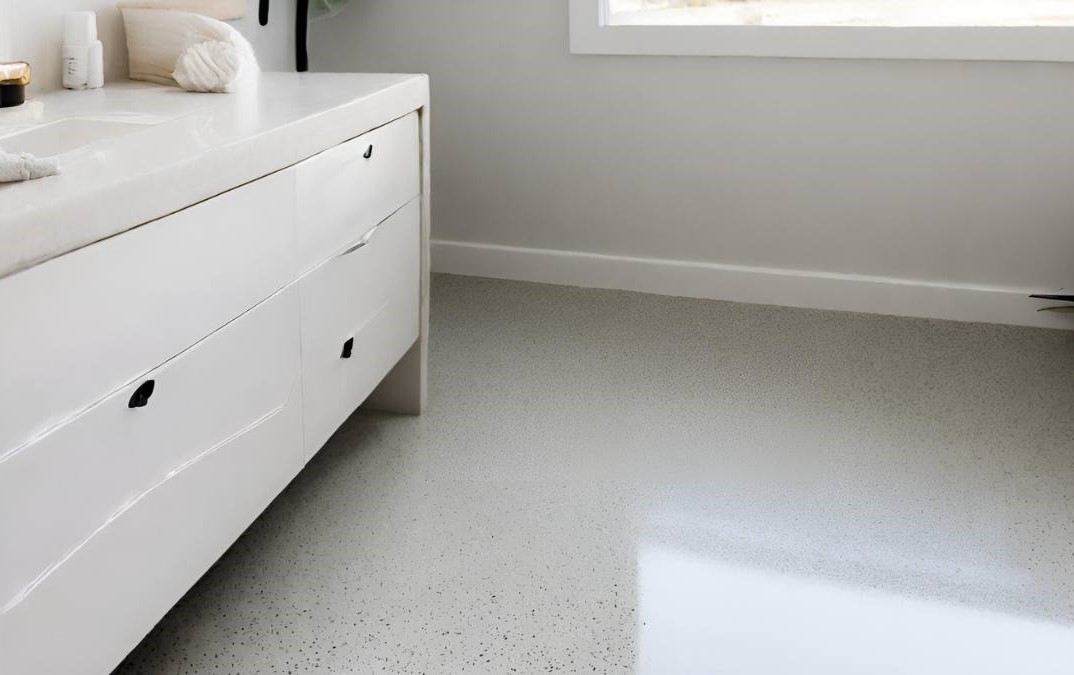 a salt and pepper polished concrete floor in a residential bathroom