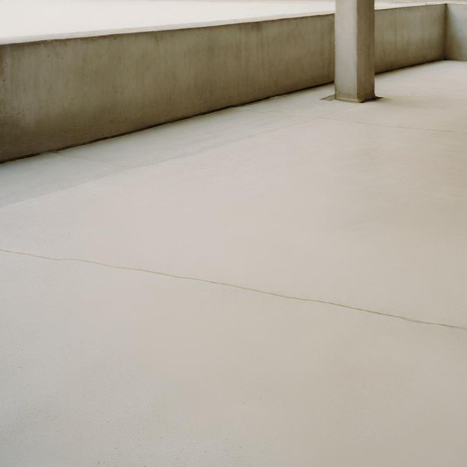 A concrete overlay that has been laid on an aged concrete foundation.