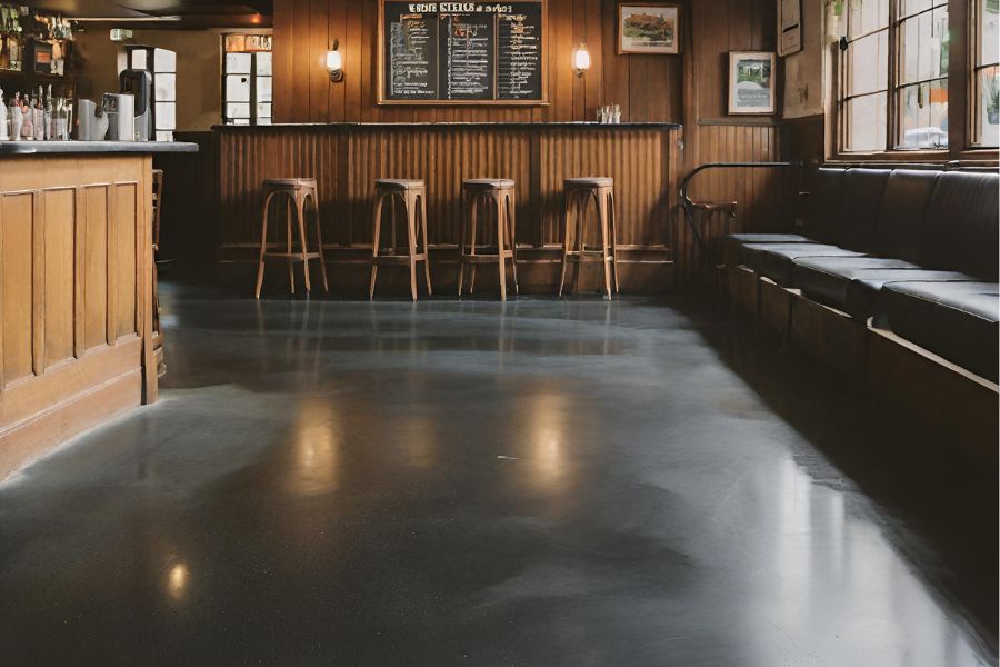 A fancy restaurant in Taunton with shiny black polished concrete flooring