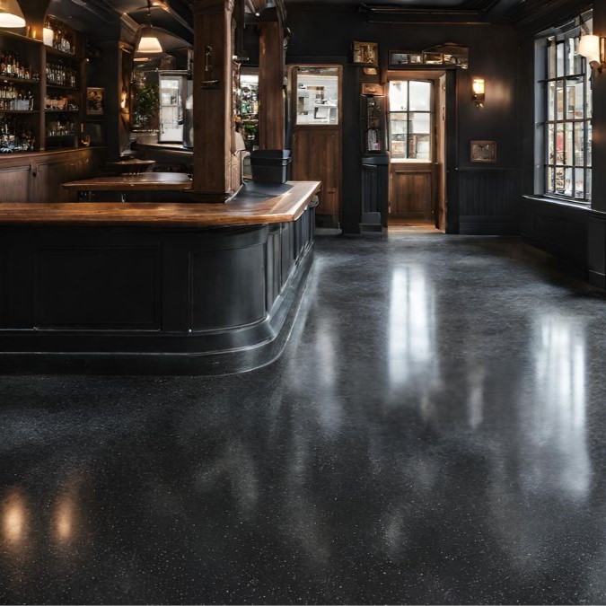 Durable black aggregate concrete flooring in a pub.