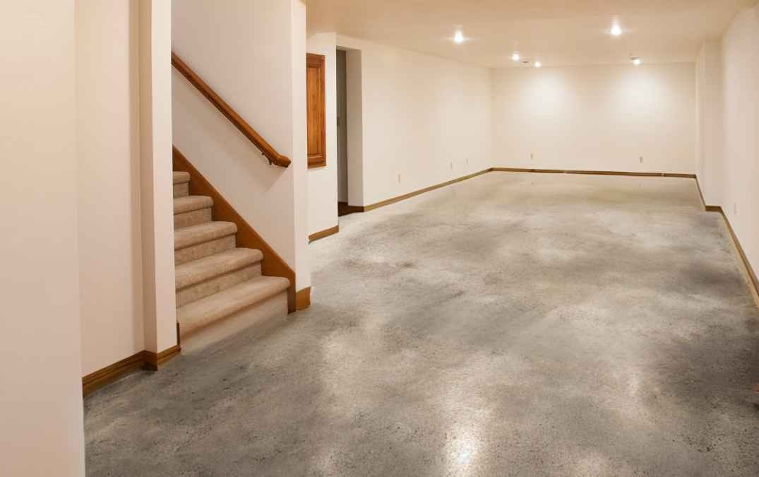 Residential basement with a polished concrete floor.