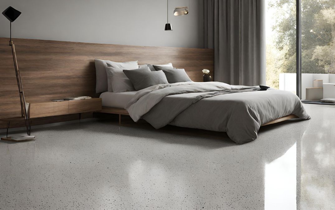 A bedroom with a polished concrete floor.