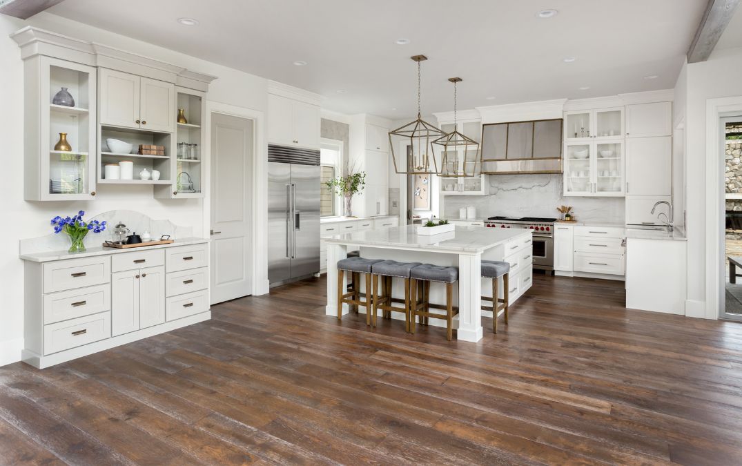 A wooden floor for a kitchen that has been laid over concrete.